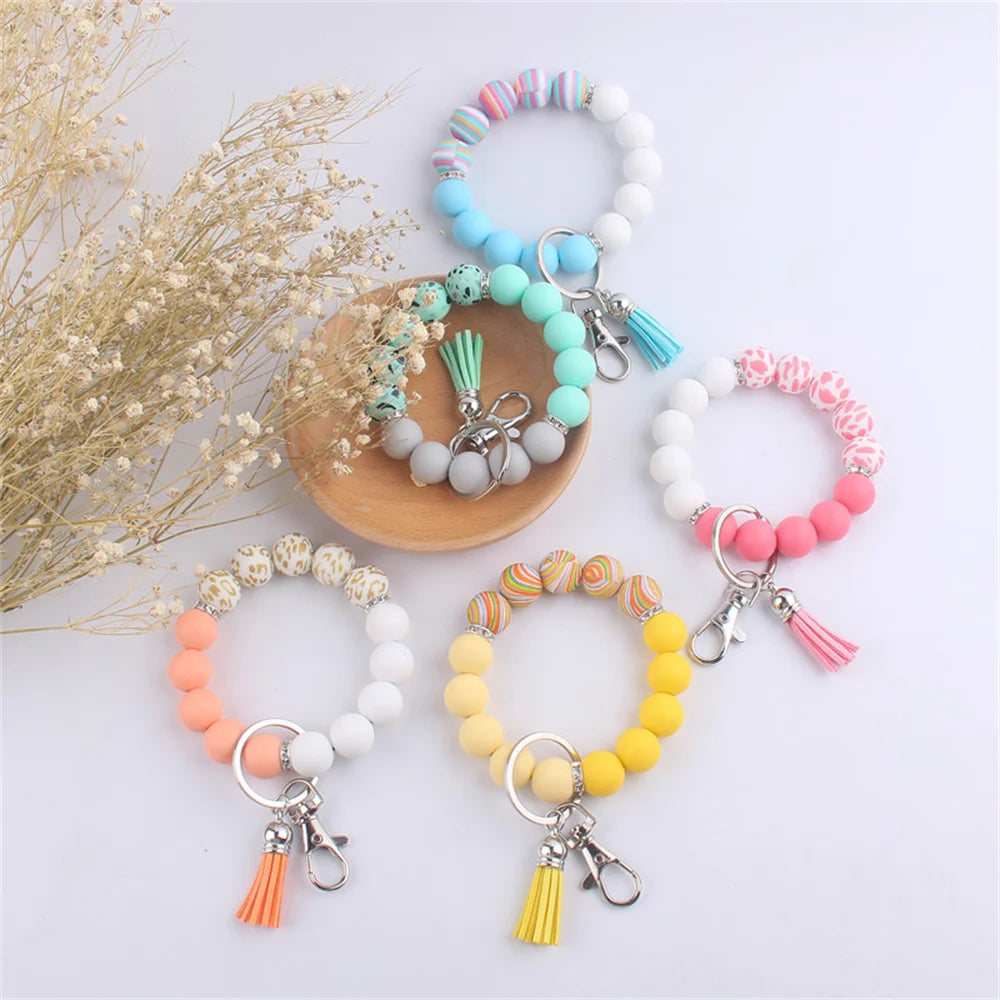 New Silicone Wrist Keychain Pendant PU Leather Small Tassel Print Leopard Print Beaded Backpack Car Keychain Accessories