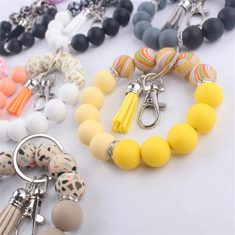 New Silicone Wrist Keychain Pendant PU Leather Small Tassel Print Leopard Print Beaded Backpack Car Keychain Accessories