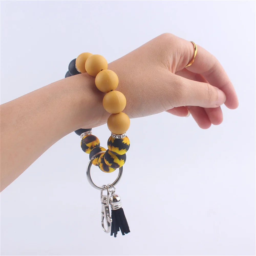 New Silicone Wrist Keychain Pendant PU Leather Small Tassel Print Leopard Print Beaded Backpack Car Keychain Accessories