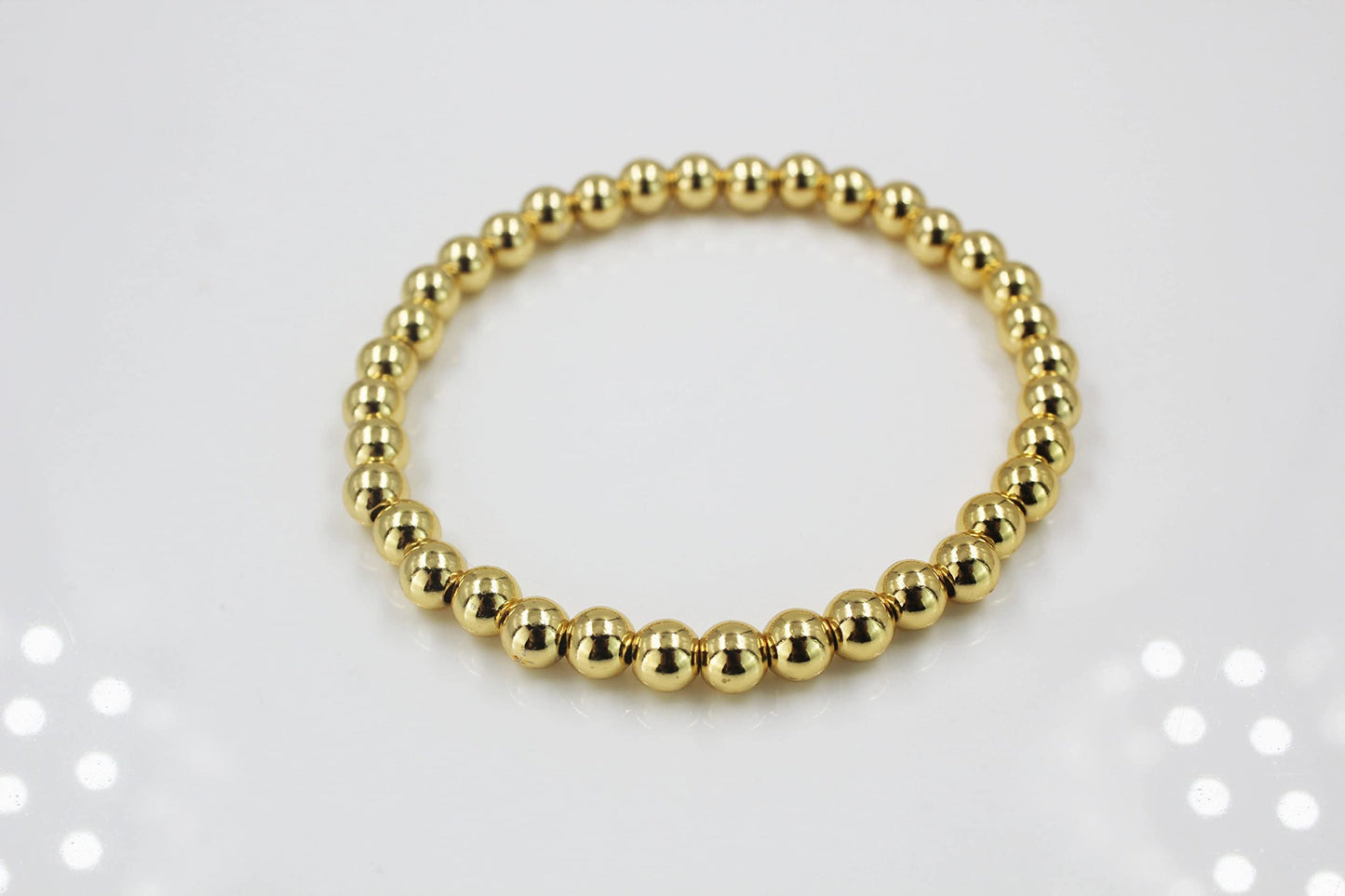 Gold and silver colour beads stretchable bracelet (set of 2)