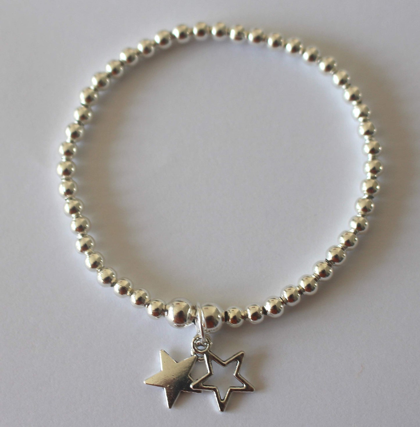 Beautiful Silver Colour Beads Stretchy Bracelet with Two Stars