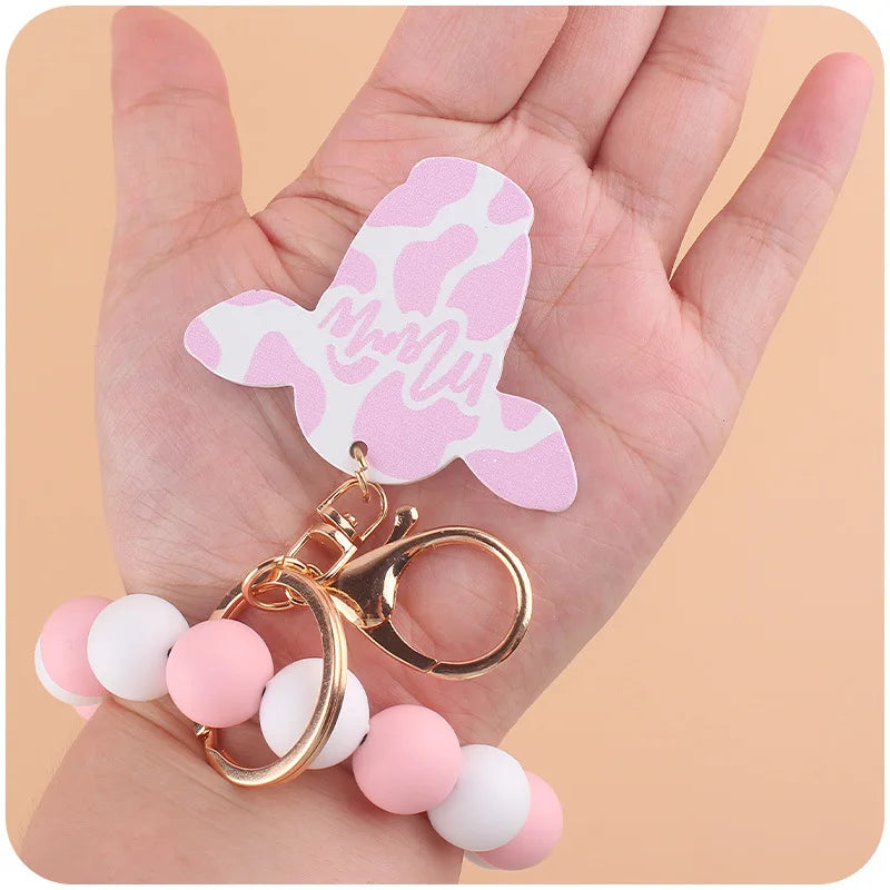Hemasa  Silicone Beads Bracelet Pendant Keychain  with Cartoon Cow Head Wooden Sign Pendant Keyring For Women/ Girls