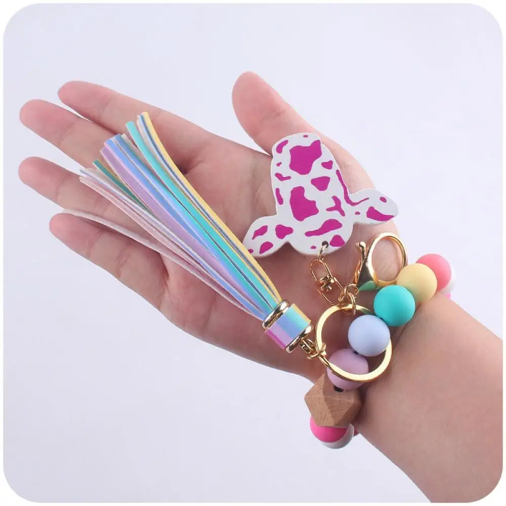 Hemasa Colorful Silicone Round Beads Keychain Cartoon Cow Head with  Wooden Sign Keyring For Women Bracelet Tassel Pendant Key Chain