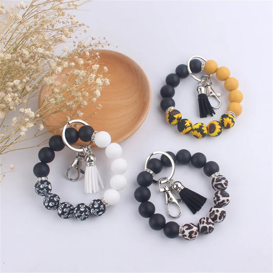 New Silicone Wrist Keychain Pendant PU Leather Small Tassel Print Leopard Print Beaded Backpack Car Keychain Accessories