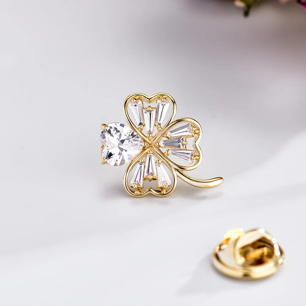 Simple and fashionable small fragrant four-leaf clover horse needle micro-inlaid zircon copper plated real gold lapel pin
