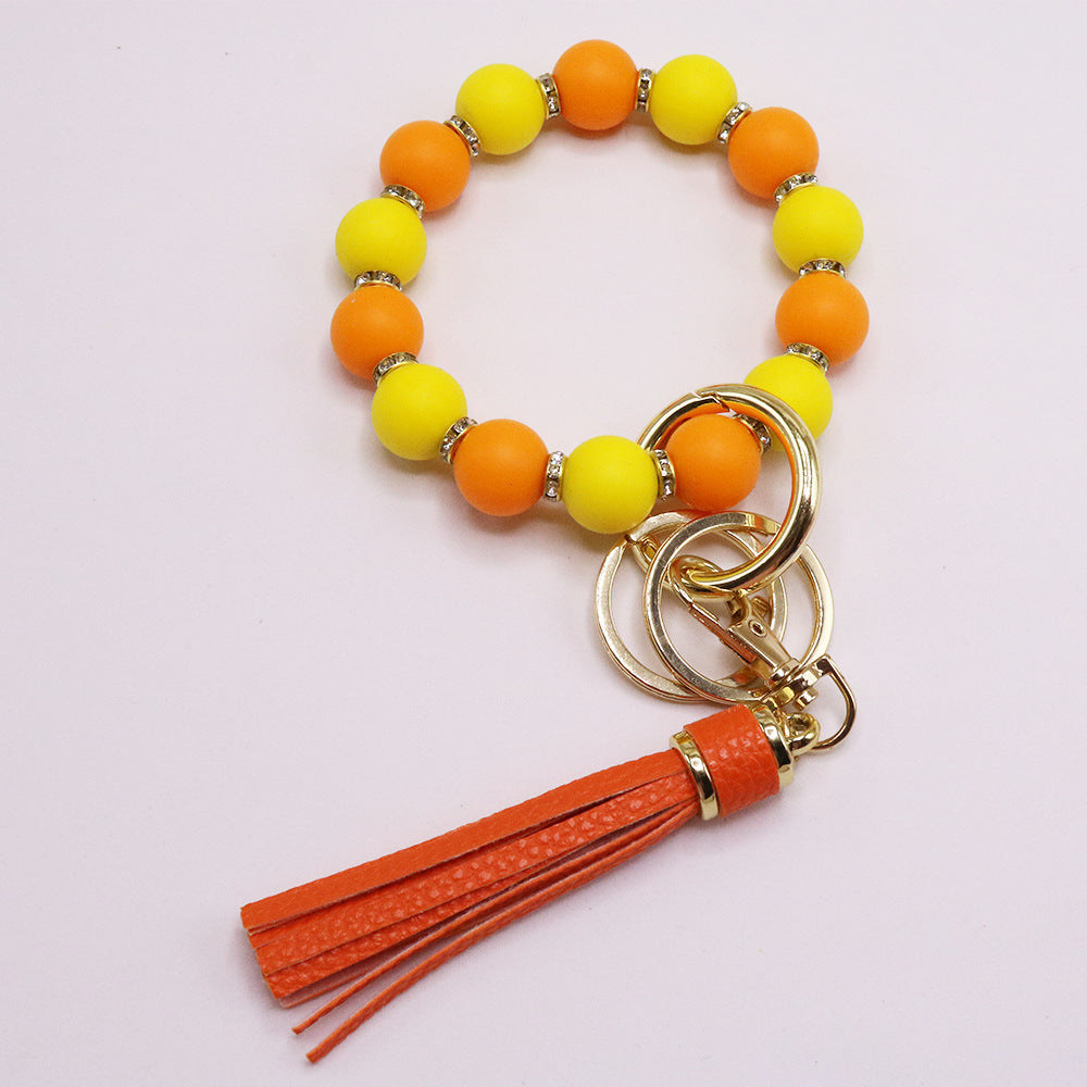Chic Sunflower Silicone Bead Bracelet with Rhinestone Accents, Tassel Charm & Keychain - Fashionable Women's Accessory